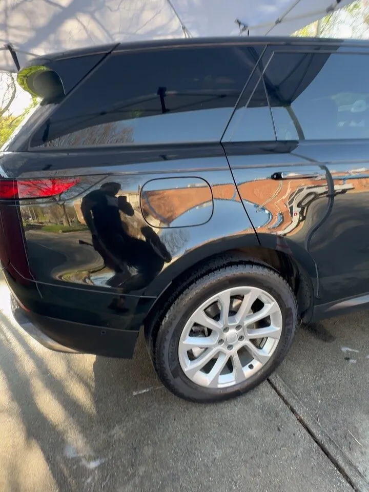 A glossy black Range Rover after detailing